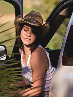 Megan Piper takes her top off in the back of a pickup truck