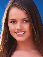 Tori Black strips on a couch