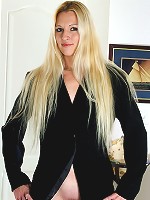 Long haired blonde Kyra spreads her long legs to reveal her shaven pussy