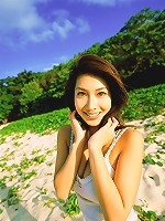 Stunning asian beauty entices in her skimpy bikini at the beach