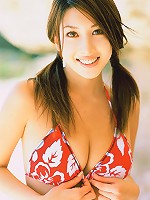 Stunning asian beauty entices in her skimpy bikini at the beach