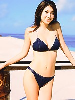 Stunning asian beauty entices in her skimpy bikini at the beach