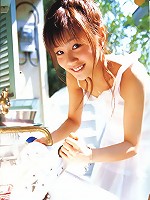 Cute asian girl is flirtatious with her long hair in a dress