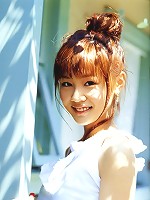 Cute asian girl is flirtatious with her long hair in a dress