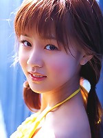 Cute asian girl is flirtatious with her long hair in a dress