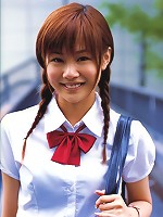 Cute asian girl is flirtatious with her long hair in a dress