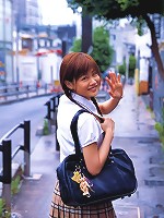 Cute asian girl is flirtatious with her long hair in a dress