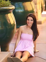 Racquel shows it all sitting on a park bench