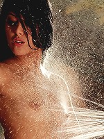 Kimberly Gates sprays down her furry friend in the tub