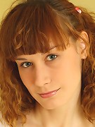 Nubiles.net Dima - Curly haired babe flaunts her curvy body and shows her sweet pussy on the couch