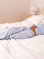 Lovely brunette sheds pajamas and fucks vibrators in bed